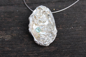 Sterling silver clam shell pendant with Aquamarine